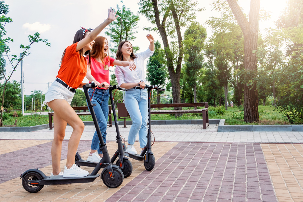 Girls Posing on E-Scooters